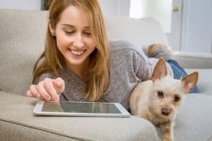 woman and dog and tablet