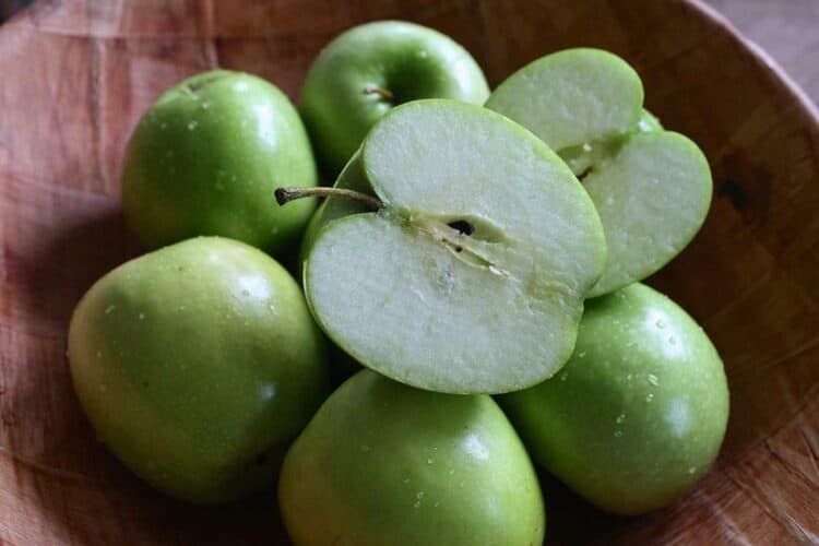 green apples on a basket