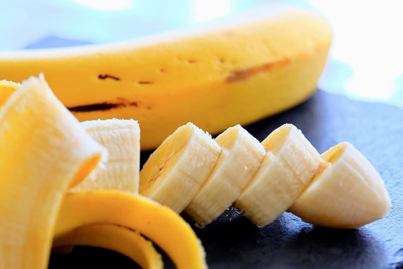 half peeled and sliced banana