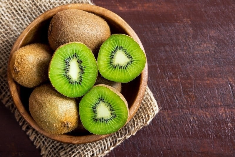 kiwis in a wooden bowl