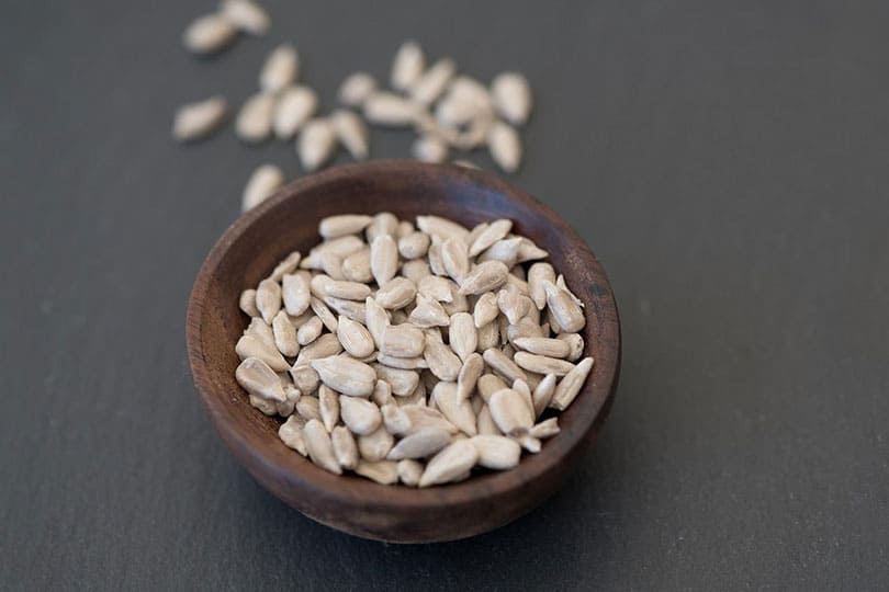sunflower seeds in wooden bowl